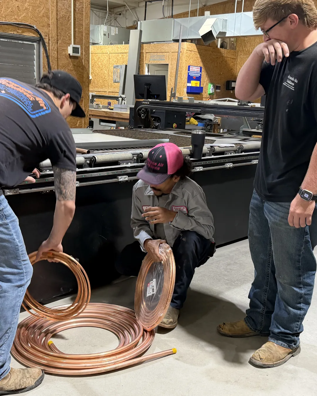 The Hawkins crew working with copper line sets in the Abilene shop